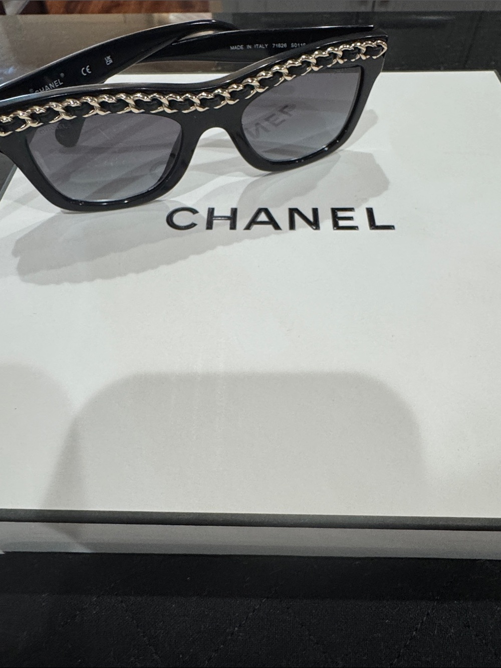 CHANEL Black Cat-Eye Sunglasses with Gold Chain Trim